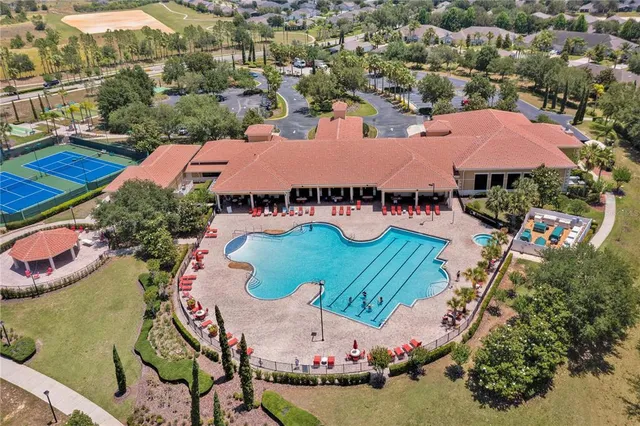 an aerial view of residential houses and outdoor space