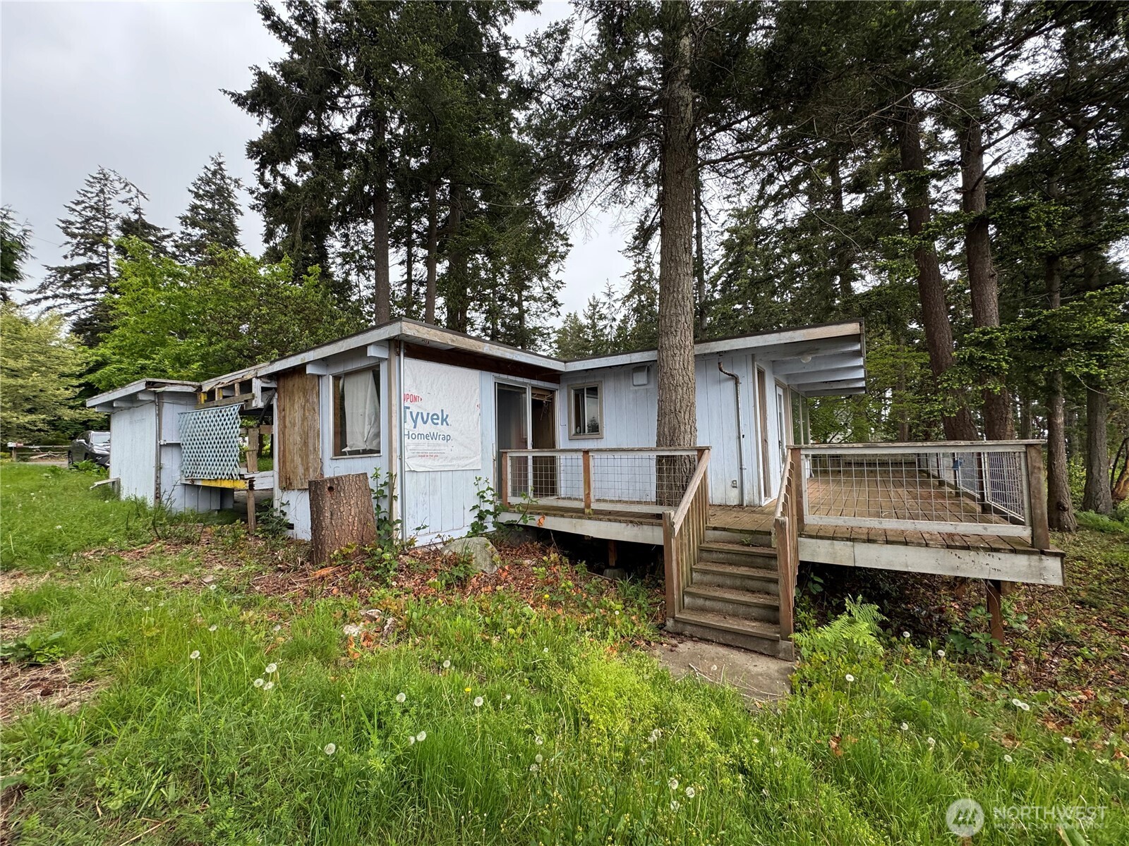 1284 Dines Point Road Greenbank, WA 98253 - Photo 24 of 39 a view of a house with a yard