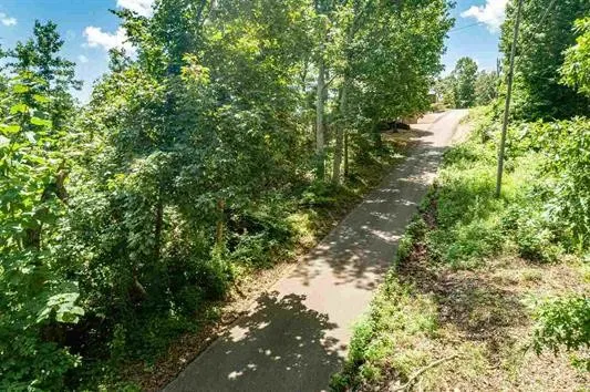a backyard of a house with a yard and outdoor seating