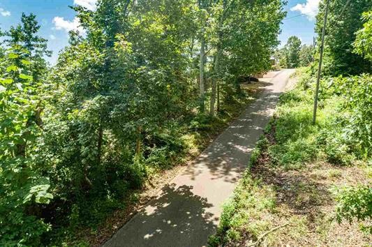 0 Ridgeway Drive Sugar Tree, TN 38380 - Photo 3 of 12 a backyard of a house with a yard and outdoor seating