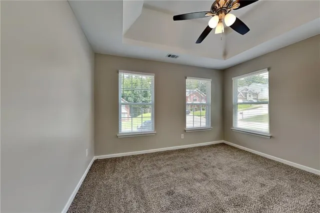 a view of an empty room and window