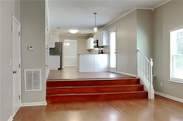 a view of entryway and hall with dining room