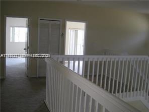15847 Southwest 55th Terrace Miami, FL 33185 - Photo 12 of 13 a view of a hallway with wooden floor and a window