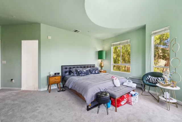 a bedroom with furniture and a window