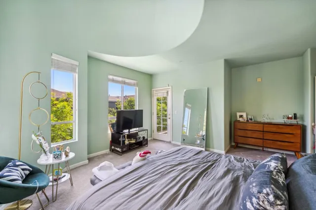 a bedroom with furniture and a window