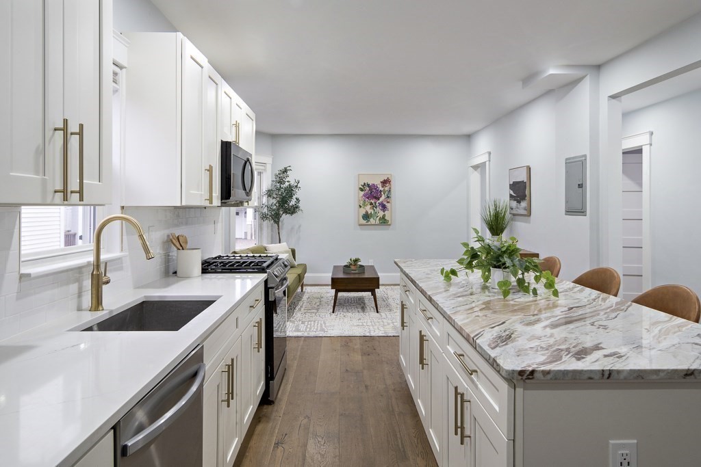75 Tower Street, Unit 1 Boston, MA 02130 - Photo 3 of 16 a kitchen with granite countertop a sink and stove
