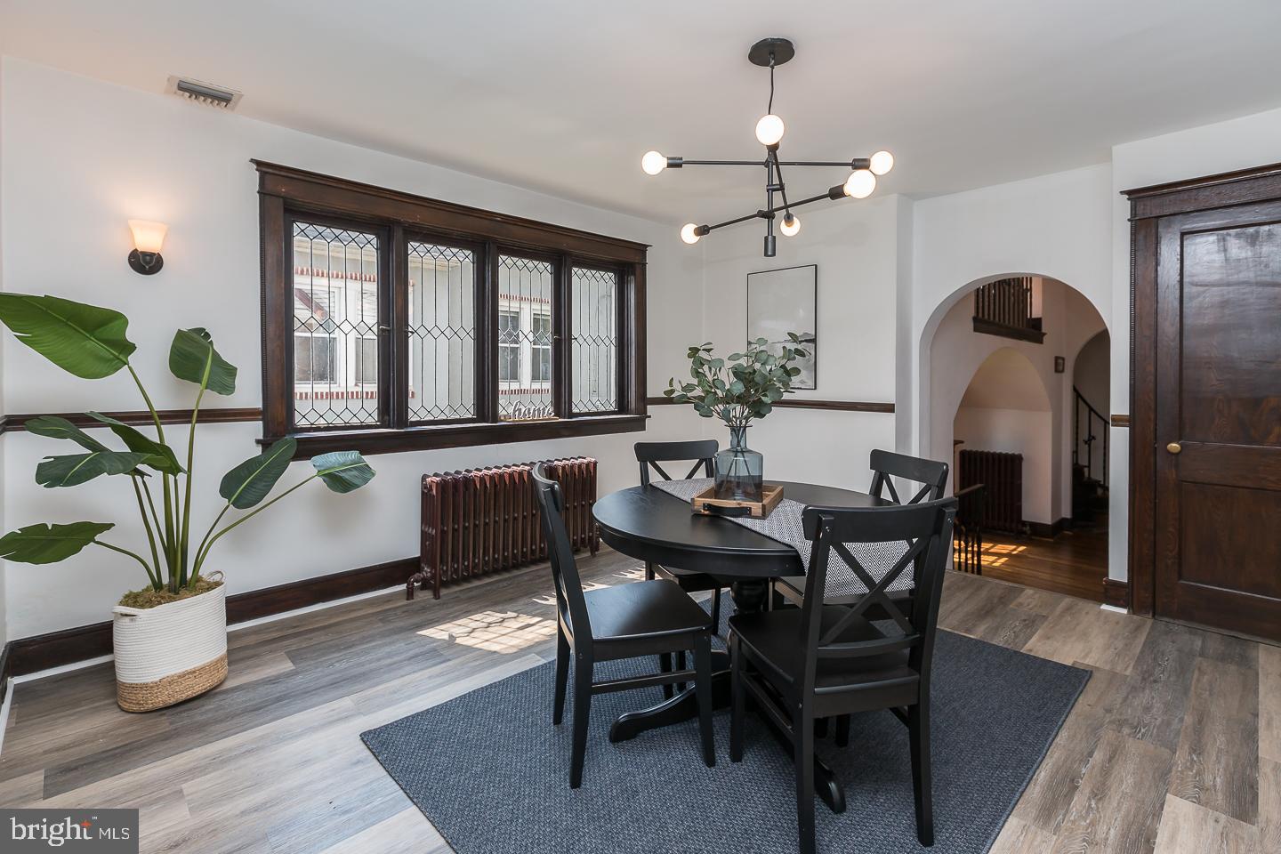 615 East Manoa Road Havertown, PA 19083 - Photo 14 of 51 a dining room with furniture potted plants and wooden floor