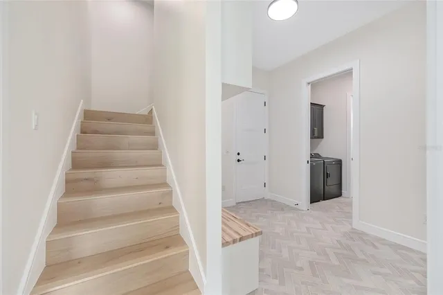 an empty room with closet and a ceiling fan