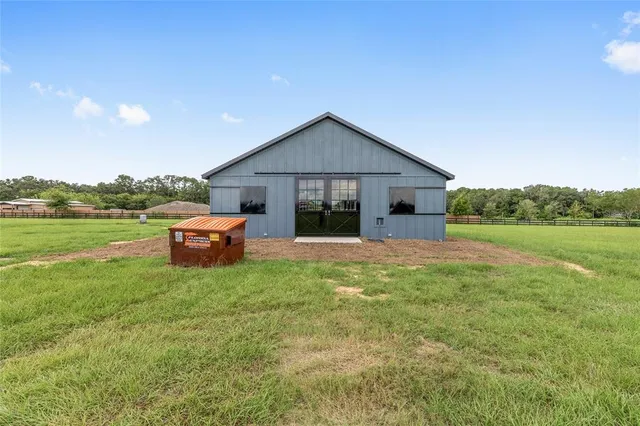 a view of a golf course with a lake view