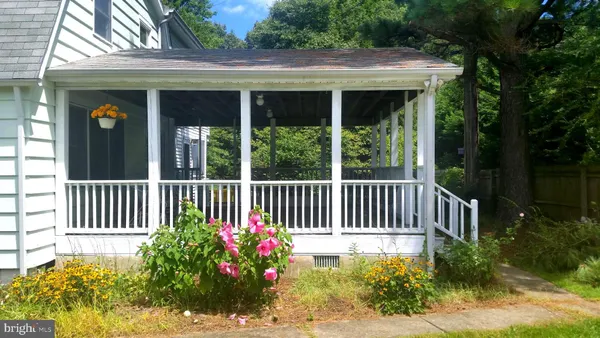 a view of a porch with a garden