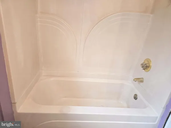 a close up of a bathtub in a bathroom