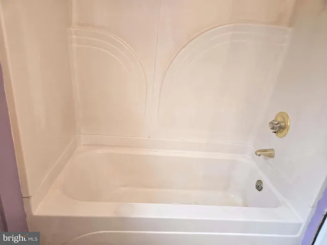 a close up of a bathtub in a bathroom