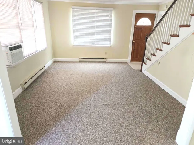 a view of an empty room with stairs