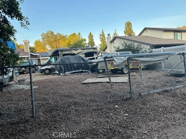 a view of a house with backyard space and porch