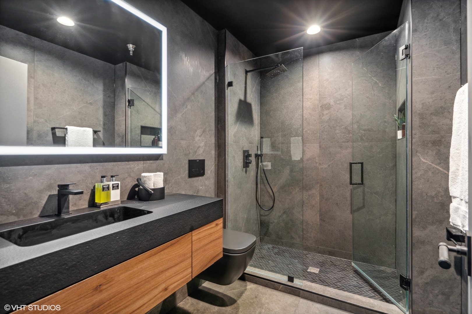 312 North May Street, Unit 6L Chicago, IL 60607 - Photo 13 of 14 a bathroom with a double vanity sink toilet and shower