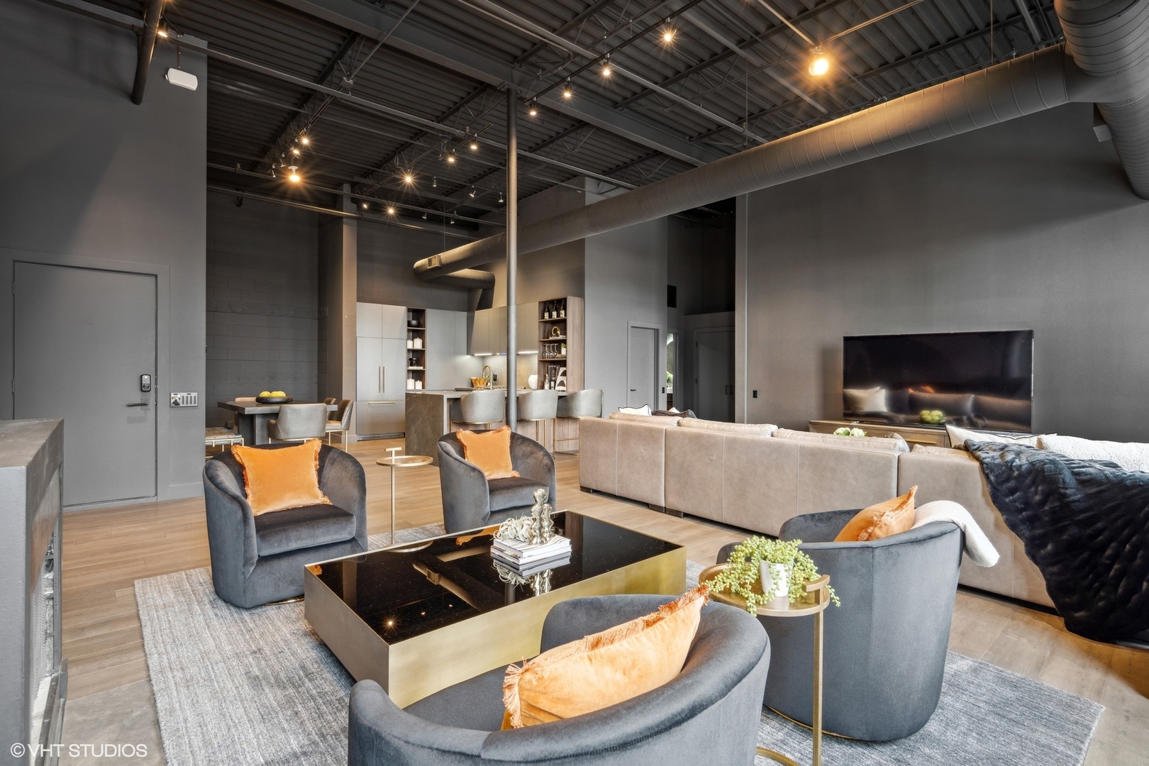 312 North May Street, Unit 6L Chicago, IL 60607 - Photo 2 of 14 a living room with furniture and a flat screen tv