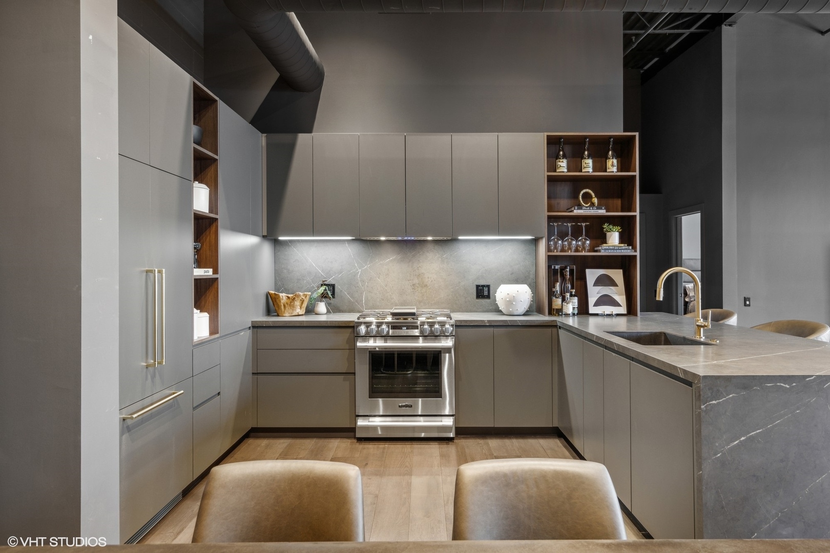 312 North May Street, Unit 6L Chicago, IL 60607 - Photo 5 of 14 a kitchen with stainless steel appliances granite countertop a sink stove and cabinets