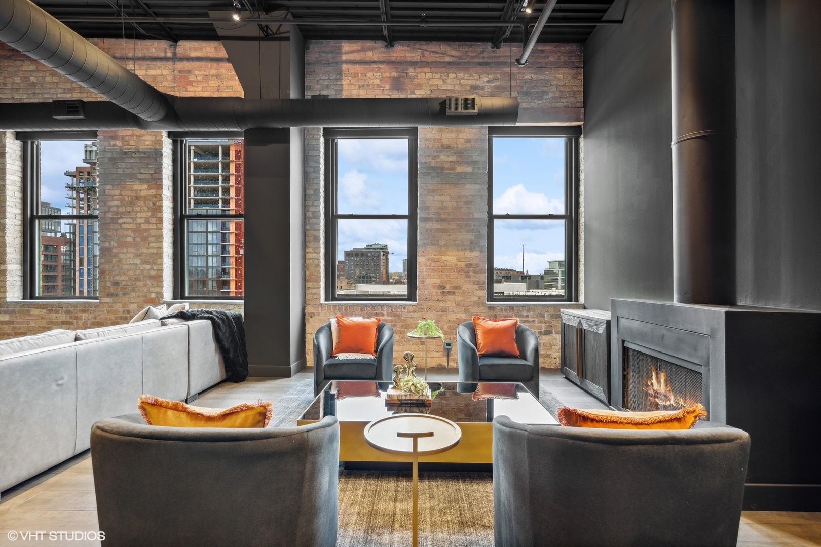 312 North May Street, Unit 6L Chicago, IL 60607 - Photo 9 of 14 a living room with furniture a fireplace and a window
