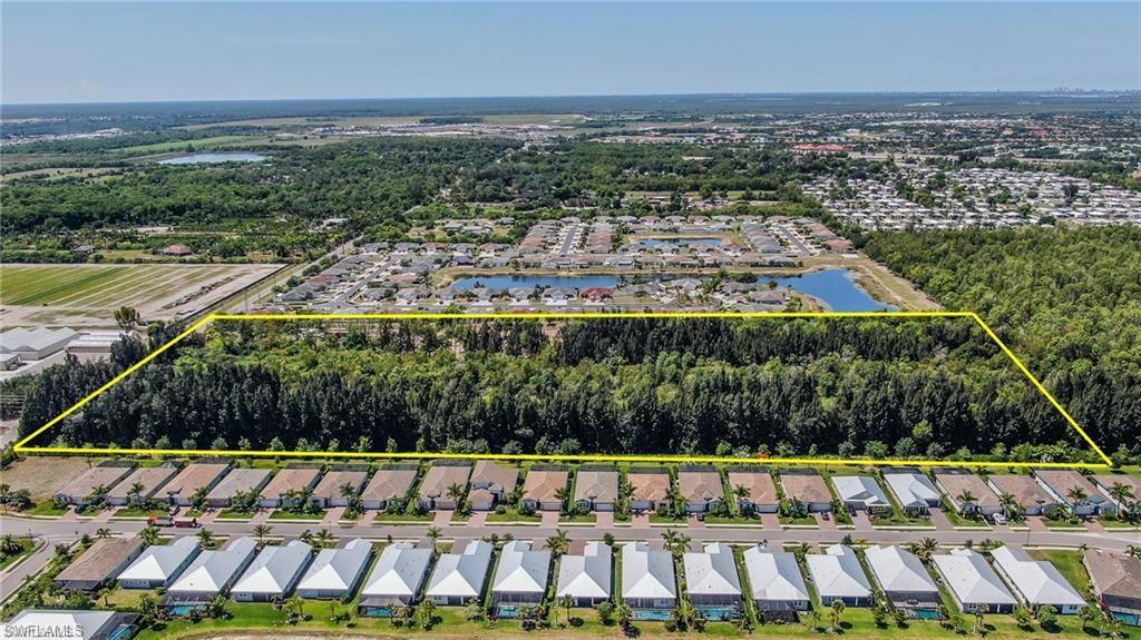 10113 Greenway Road Naples, FL 34114 - Photo 3 of 9 Drone / aerial view with a water view