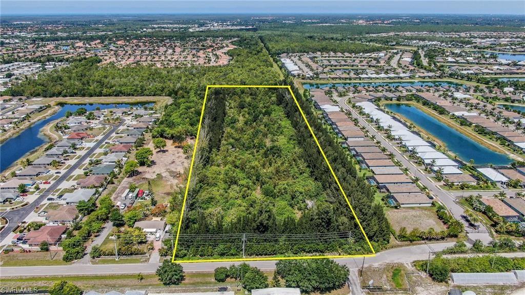 10113 Greenway Road Naples, FL 34114 - Photo 8 of 9 Aerial view with a water view
