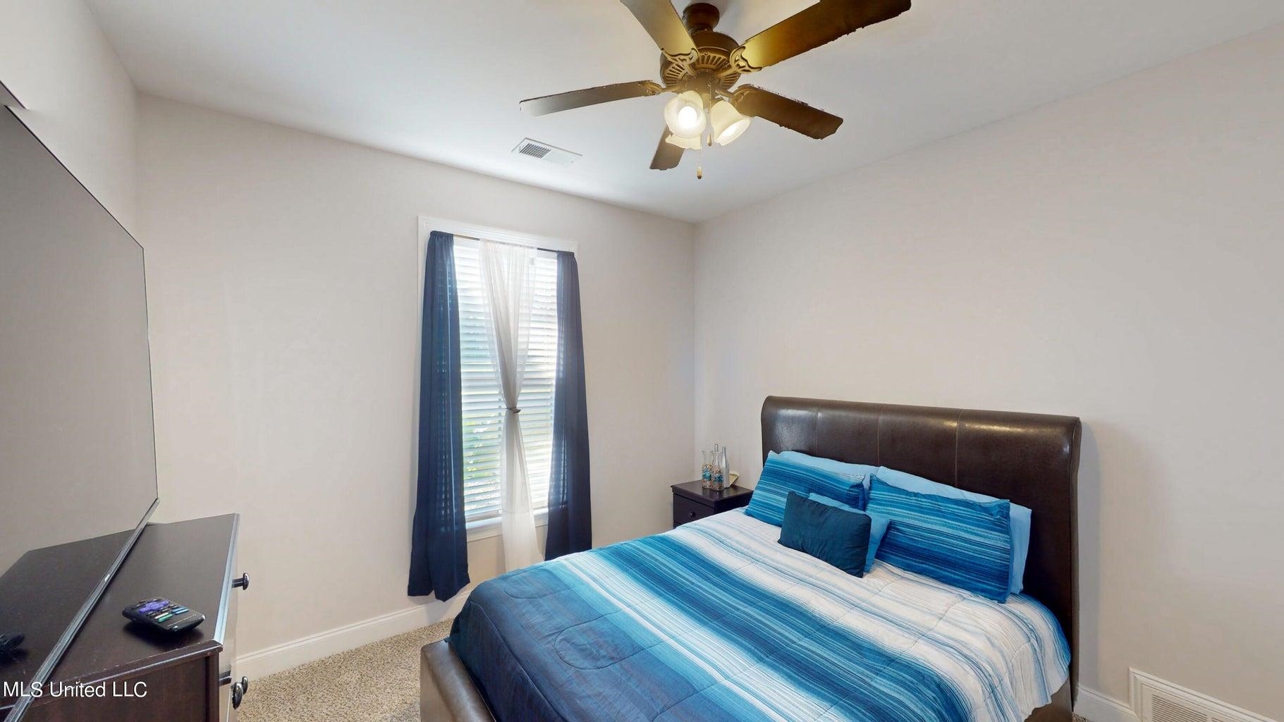 2364 Nikki Ridge Drive Nesbit, MS 38651 - Photo 15 of 26 a bedroom with a bed and a window