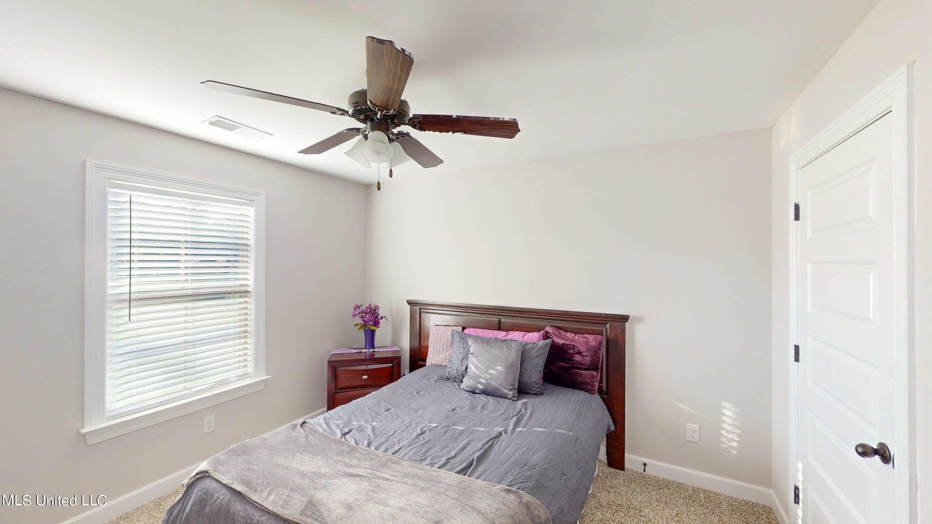 2364 Nikki Ridge Drive Nesbit, MS 38651 - Photo 17 of 26 a bedroom with a bed and a window