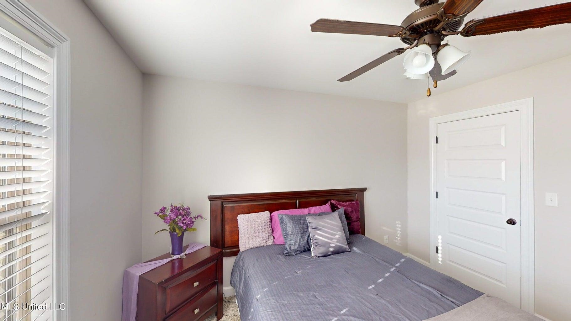 2364 Nikki Ridge Drive Nesbit, MS 38651 - Photo 18 of 26 a hallway with a chandelier and a dresser
