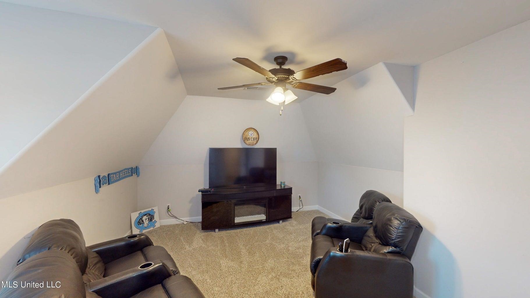 2364 Nikki Ridge Drive Nesbit, MS 38651 - Photo 20 of 26 a living room with furniture and a flat screen tv