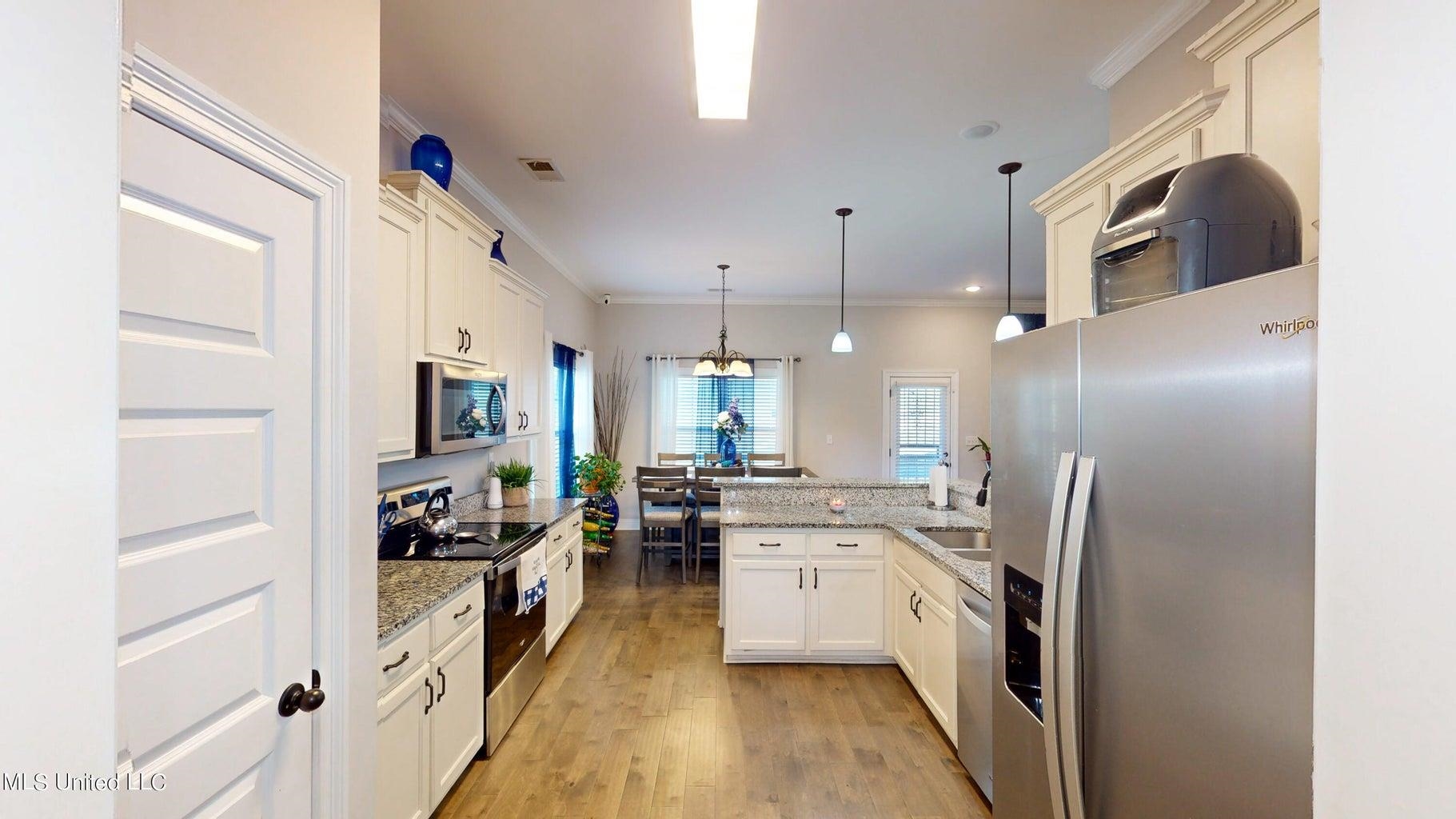 2364 Nikki Ridge Drive Nesbit, MS 38651 - Photo 9 of 26 a kitchen with cabinets and stainless steel appliances