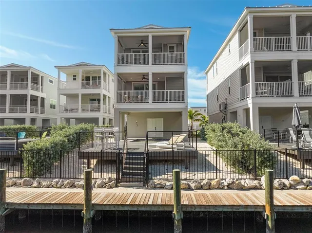 a front view of a building with a yard