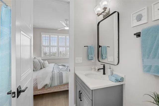 a bathroom with double vanity sinks and a mirror