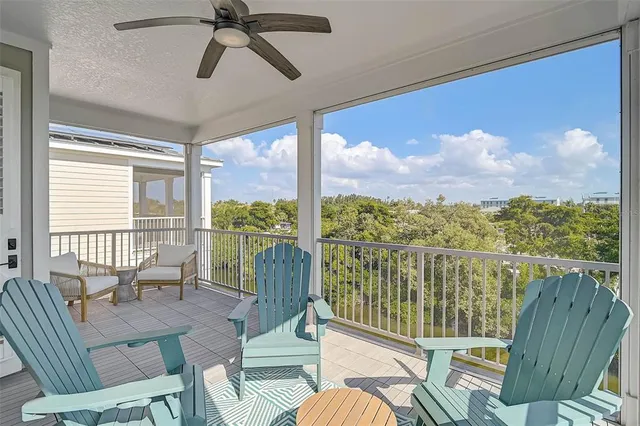 a view of a chairs and table on the wooden deck