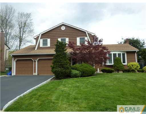 6 Purdue Road Edison, NJ 08820 - Photo 1 of 15 a front view of a house with a yard