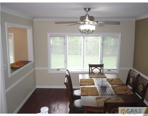 6 Purdue Road Edison, NJ 08820 - Photo 11 of 15 a living room with furniture and a chandelier
