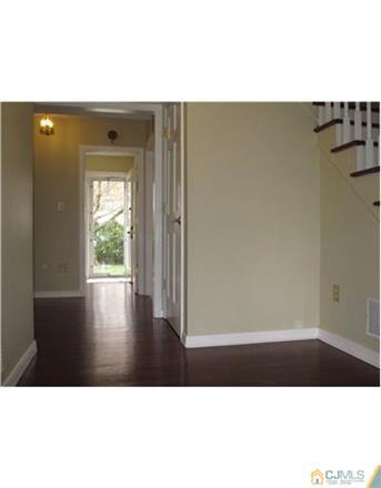 6 Purdue Road Edison, NJ 08820 - Photo 12 of 15 a view of an empty room with wooden floor