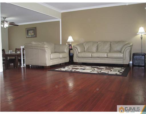 6 Purdue Road Edison, NJ 08820 - Photo 3 of 15 a living room with furniture and a wooden floor