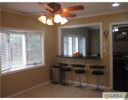 6 Purdue Road Edison, NJ 08820 - Photo 5 of 15 a room with a table chairs and a chandelier