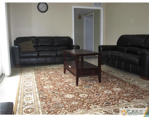6 Purdue Road Edison, NJ 08820 - Photo 8 of 15 a living room with furniture and a rug