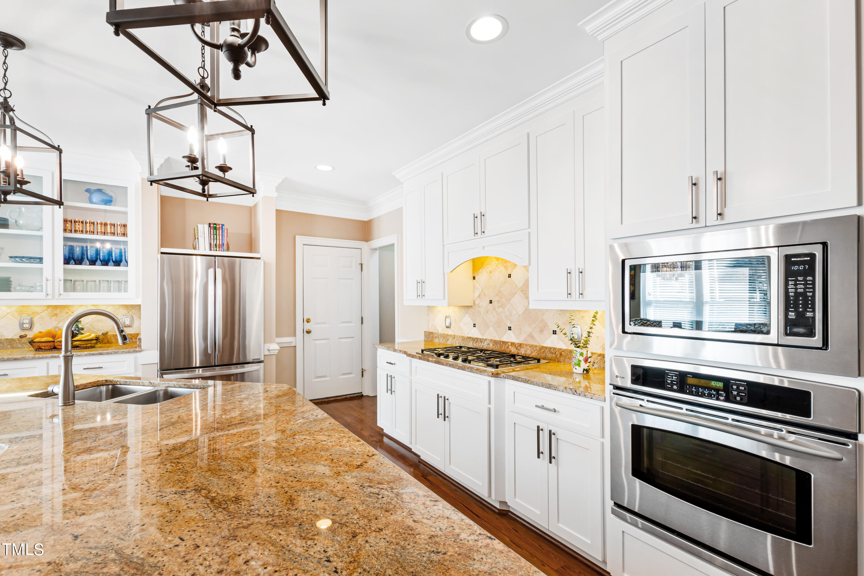 229 Woodburn Road Raleigh, NC 27605 - Photo 11 of 64 a kitchen with stainless steel appliances granite countertop a stove and a sink