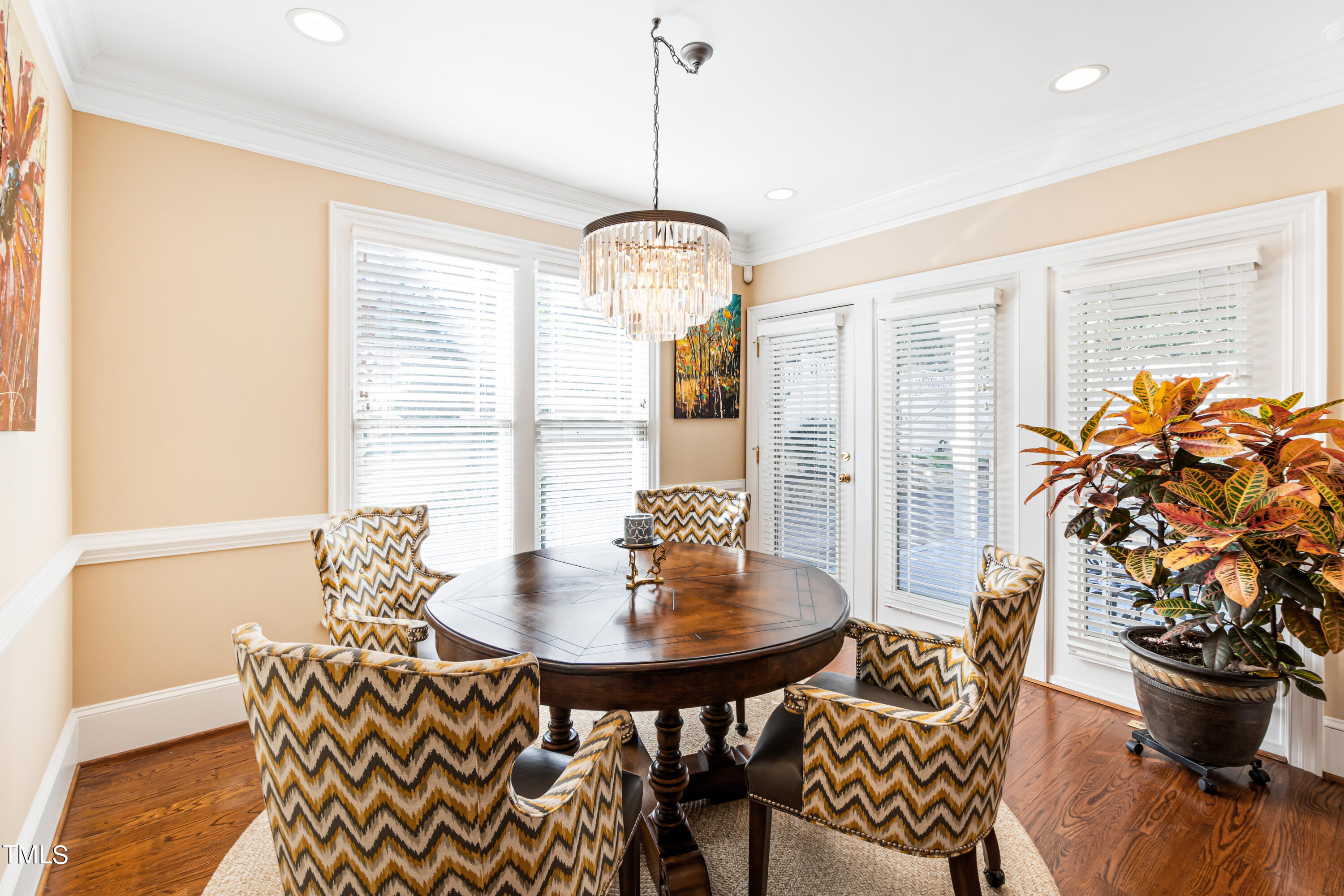 229 Woodburn Road Raleigh, NC 27605 - Photo 13 of 64 a view of a dining room with furniture window and wooden floor
