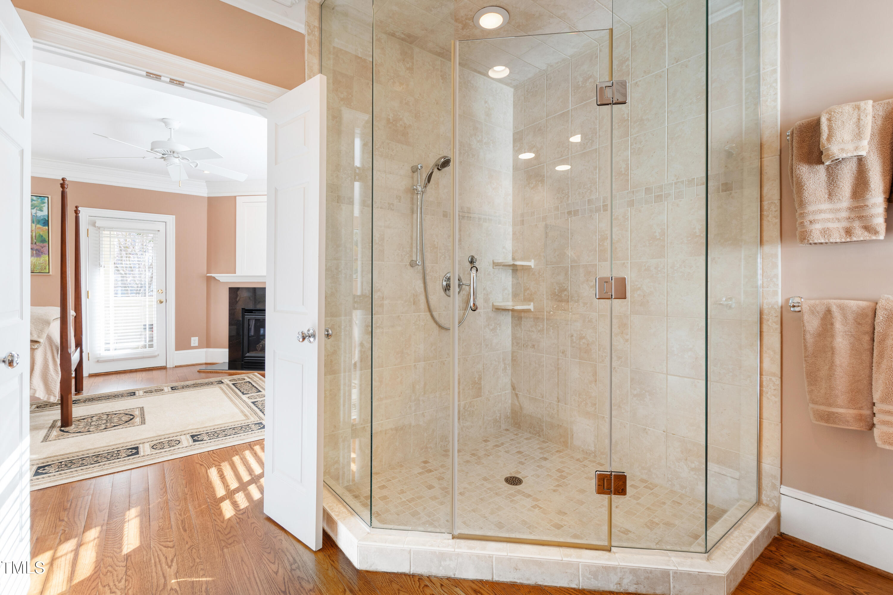 229 Woodburn Road Raleigh, NC 27605 - Photo 20 of 64 a bathroom with a granite countertop sink a glass door shower and a mirror