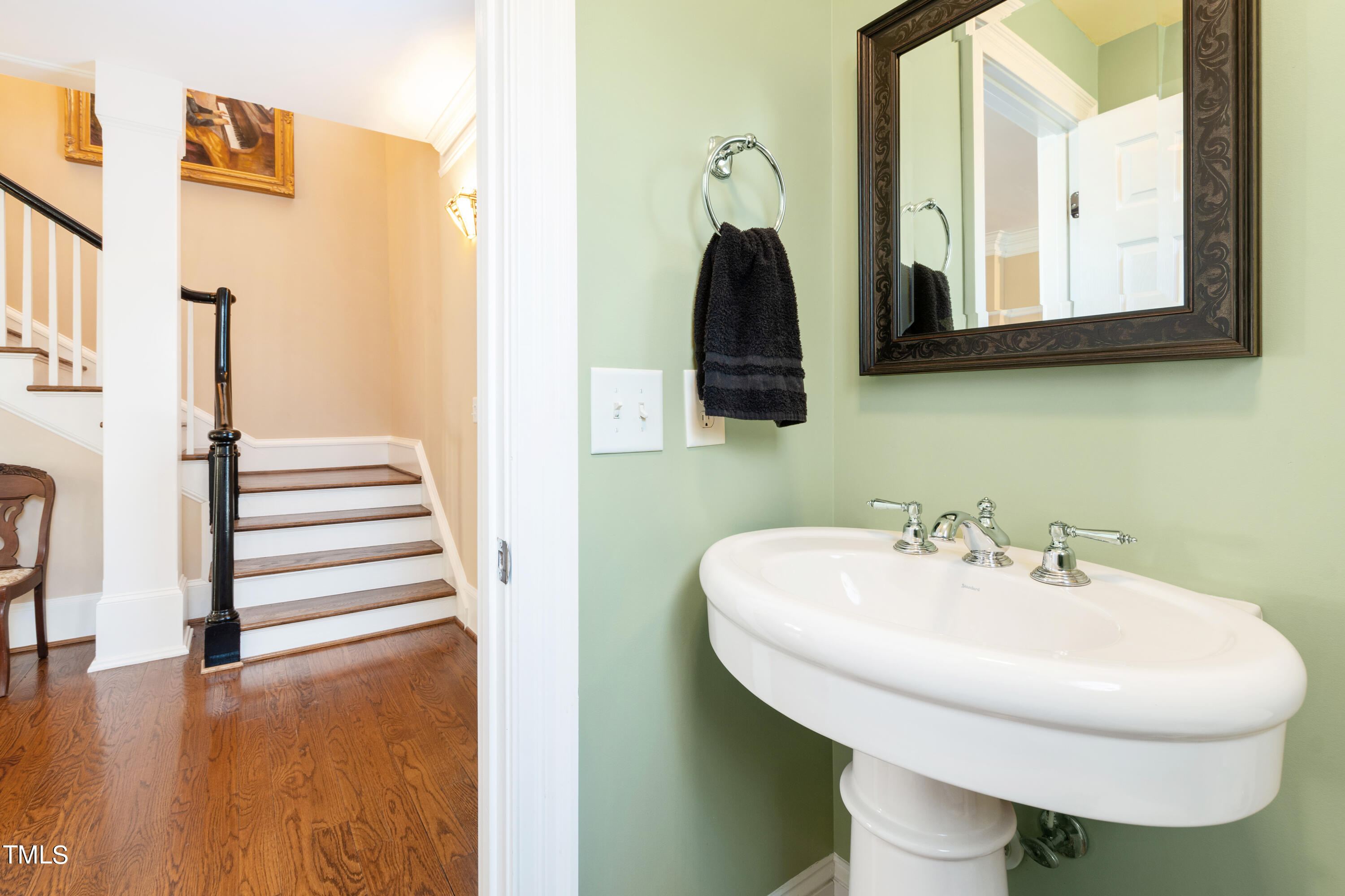 229 Woodburn Road Raleigh, NC 27605 - Photo 22 of 64 a bathroom with a sink and a mirror