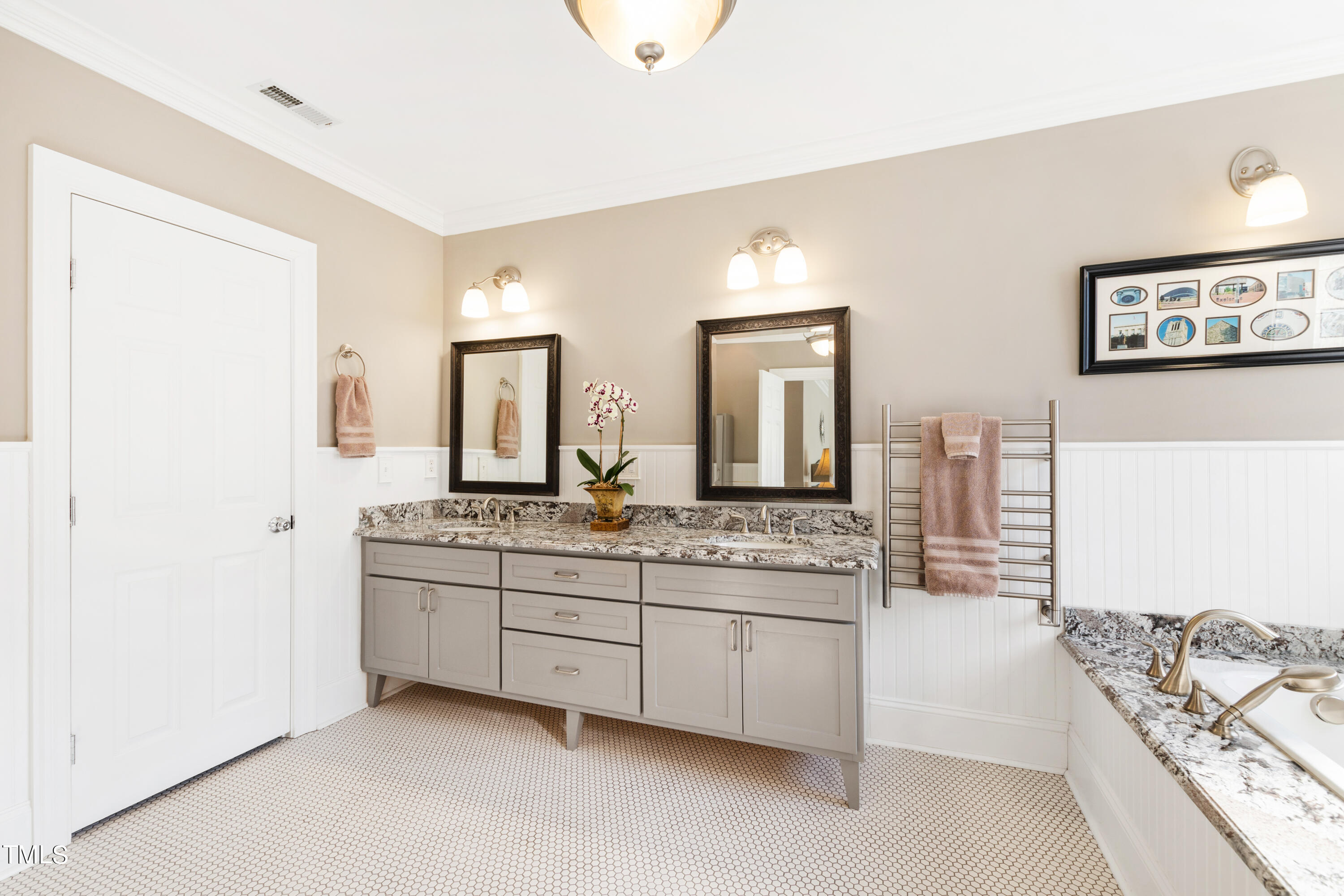 229 Woodburn Road Raleigh, NC 27605 - Photo 26 of 64 a spacious bathroom with a double vanity sink and a mirror