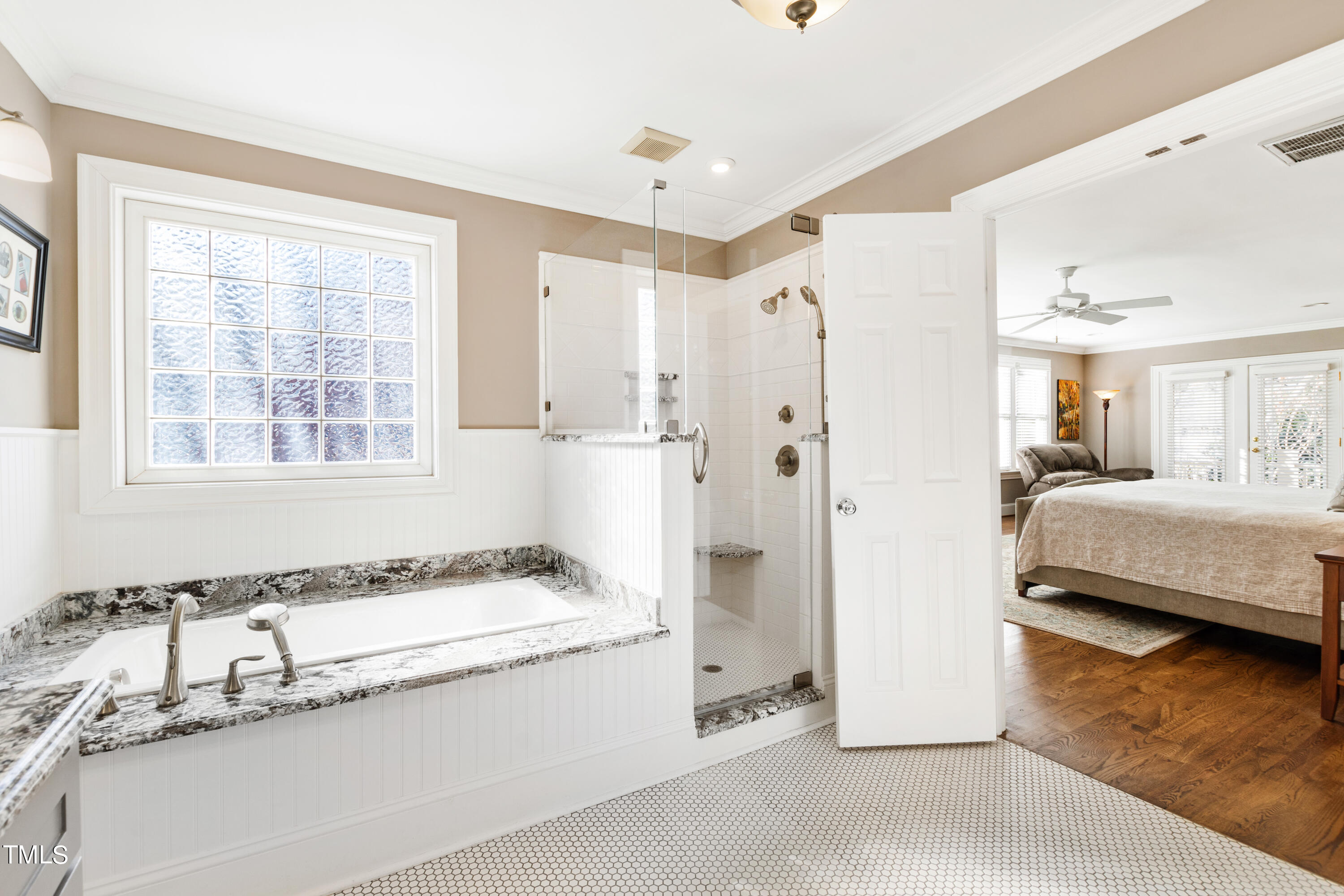 229 Woodburn Road Raleigh, NC 27605 - Photo 27 of 64 a spacious bathroom with a granite countertop tub sink and mirror