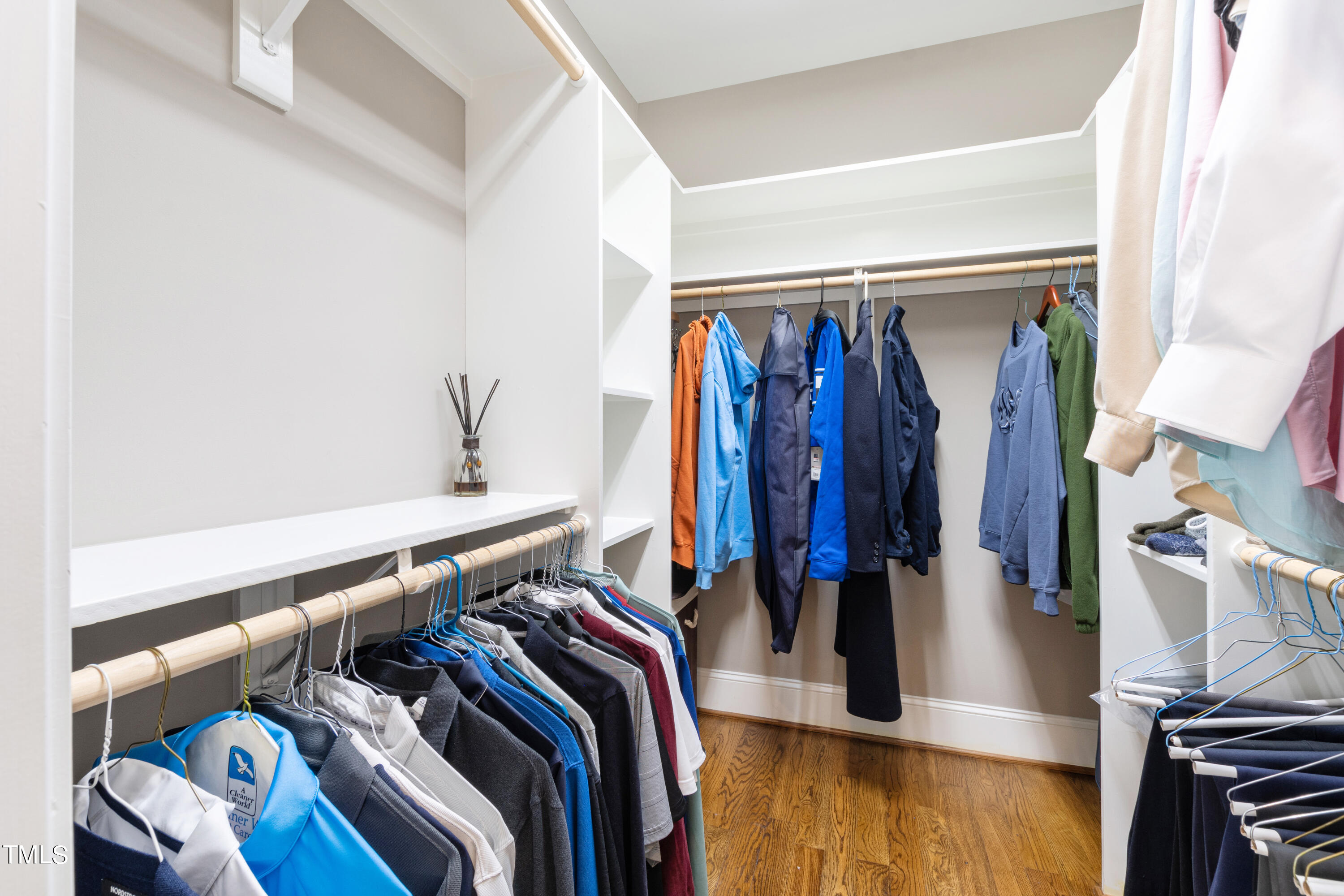 229 Woodburn Road Raleigh, NC 27605 - Photo 28 of 64 a view of walk in closet with clothes and shoes