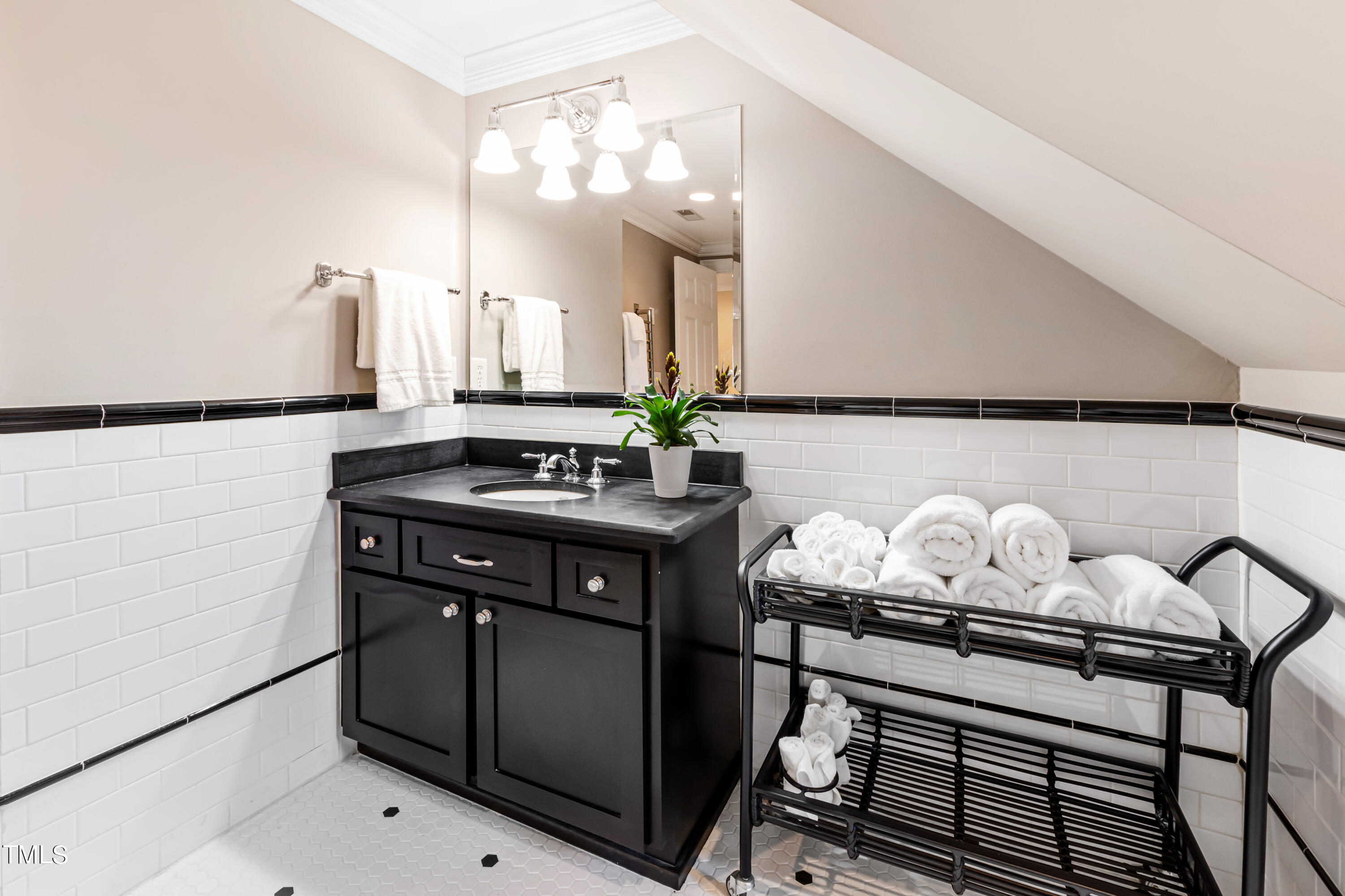 229 Woodburn Road Raleigh, NC 27605 - Photo 30 of 64 a kitchen with a sink and cabinets