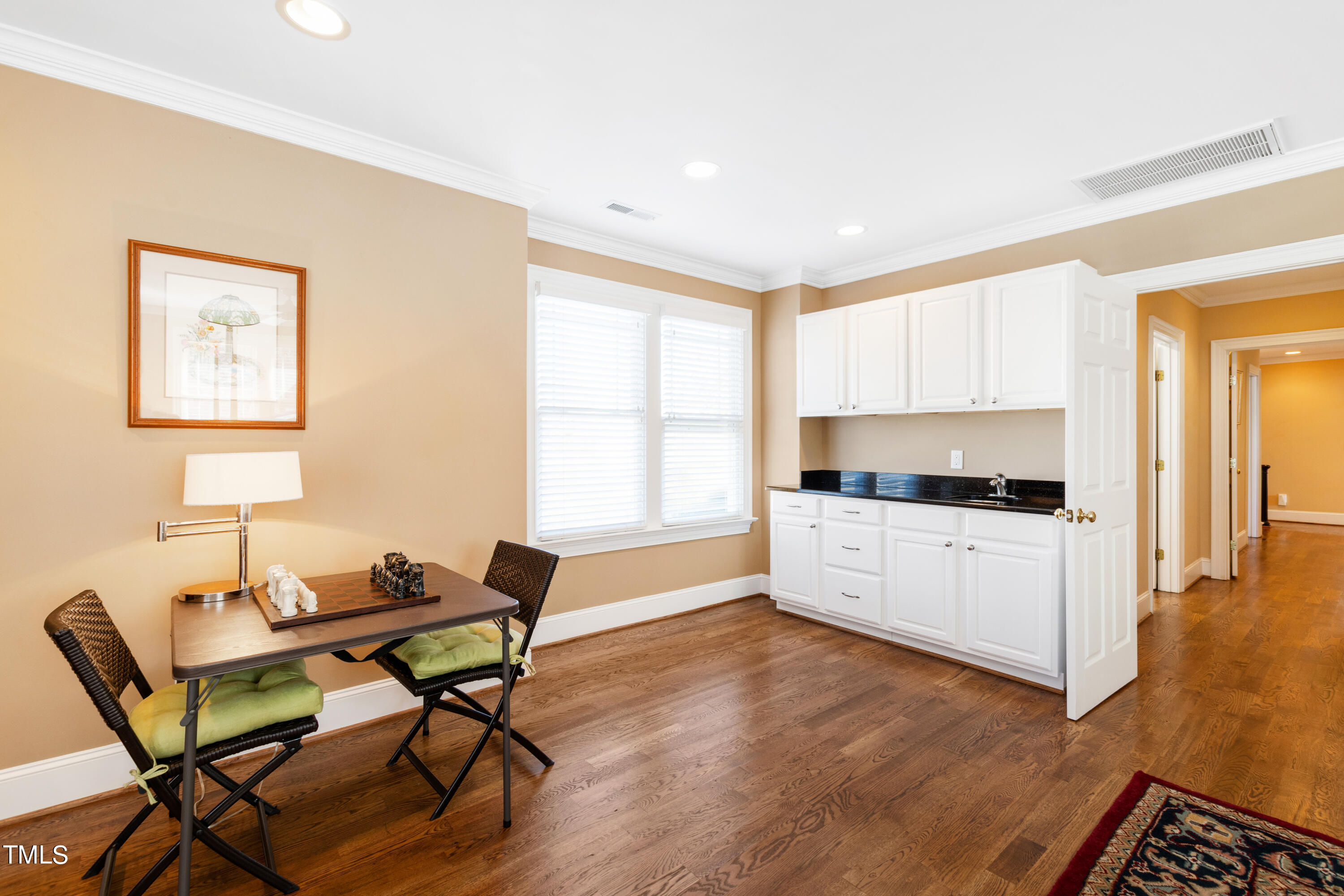 229 Woodburn Road Raleigh, NC 27605 - Photo 37 of 64 a living room with furniture a dining table and a window