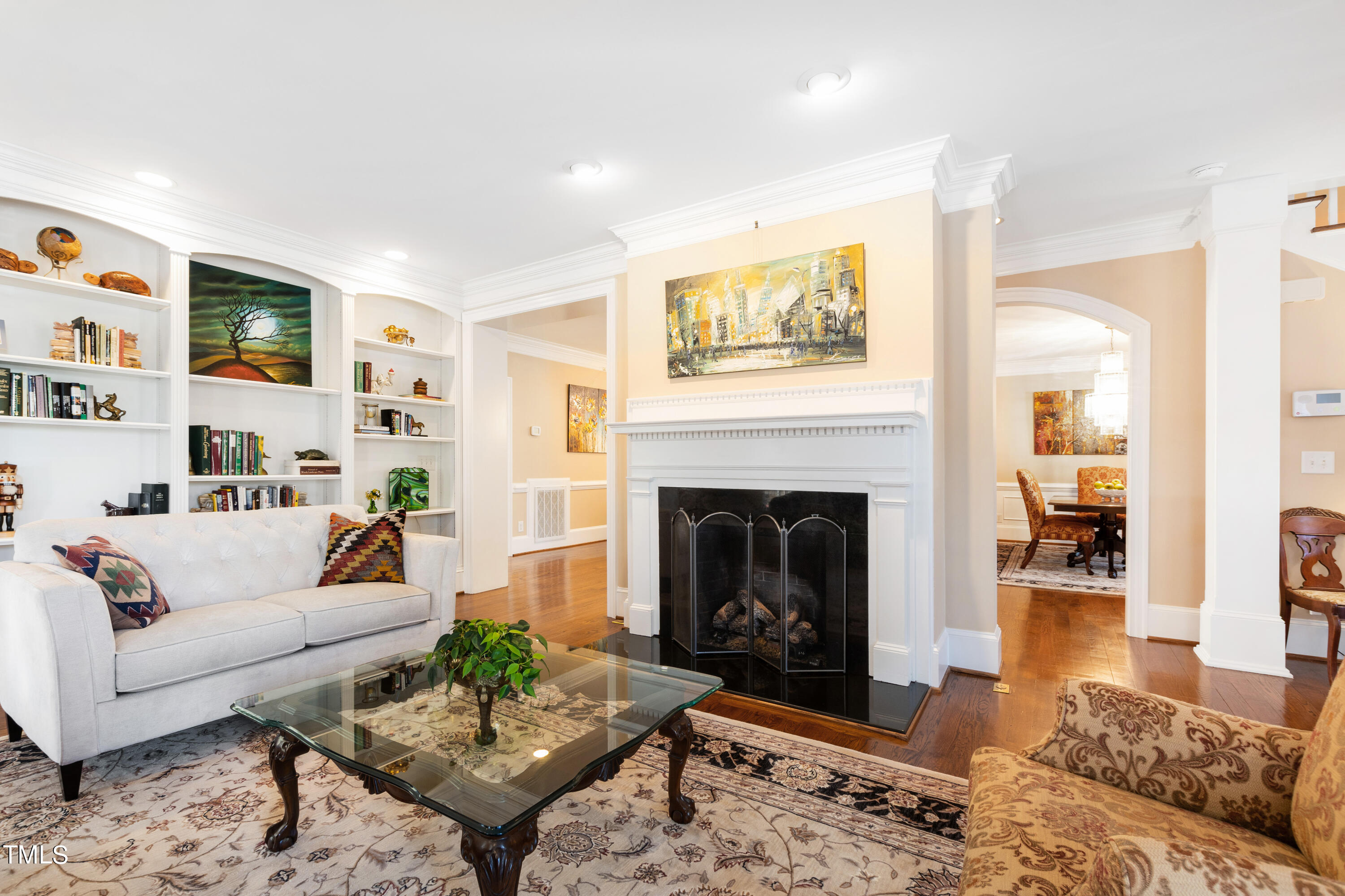 229 Woodburn Road Raleigh, NC 27605 - Photo 4 of 64 a living room with furniture and a fireplace