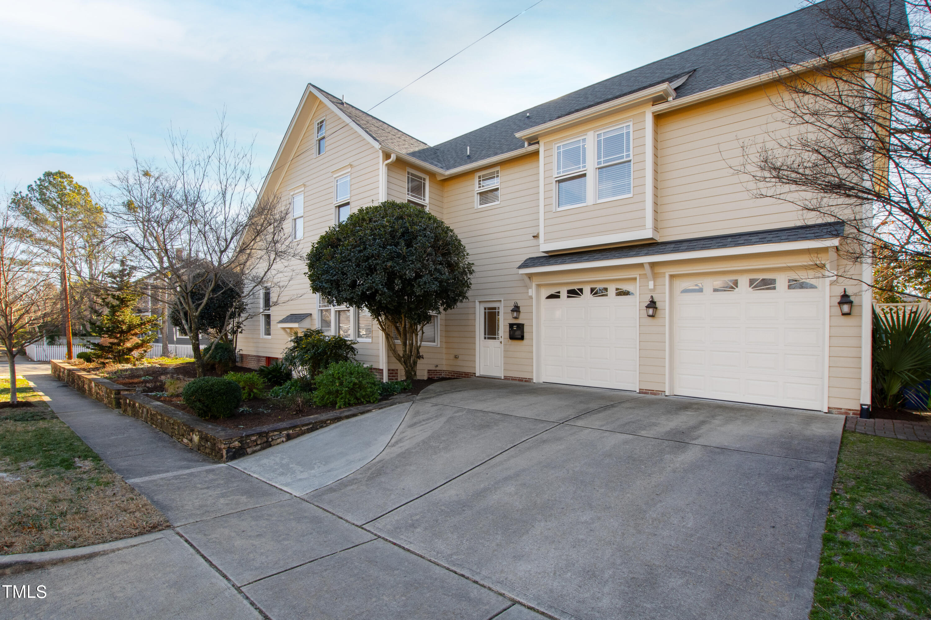 229 Woodburn Road Raleigh, NC 27605 - Photo 44 of 64 a view of a house with a yard and garage