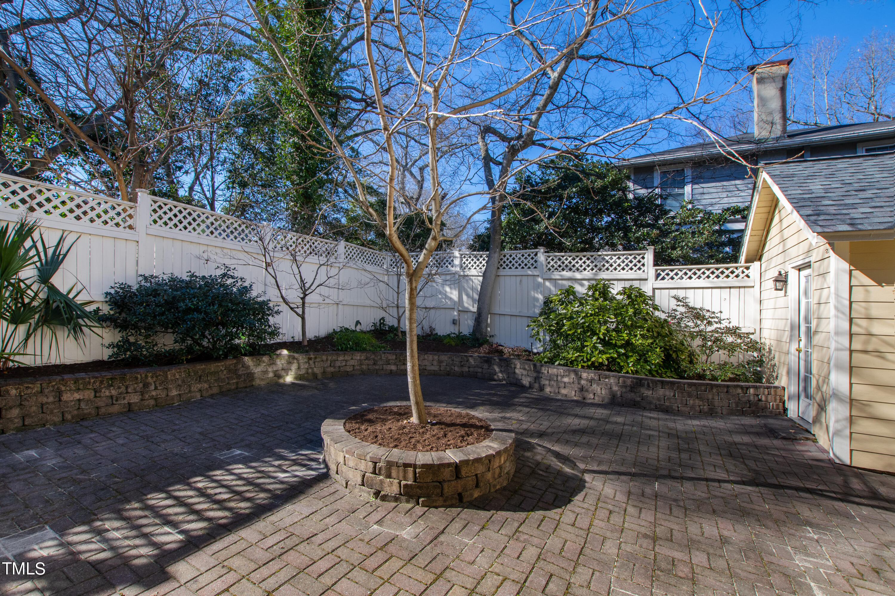 229 Woodburn Road Raleigh, NC 27605 - Photo 46 of 64 a view of a backyard with plants and a patio